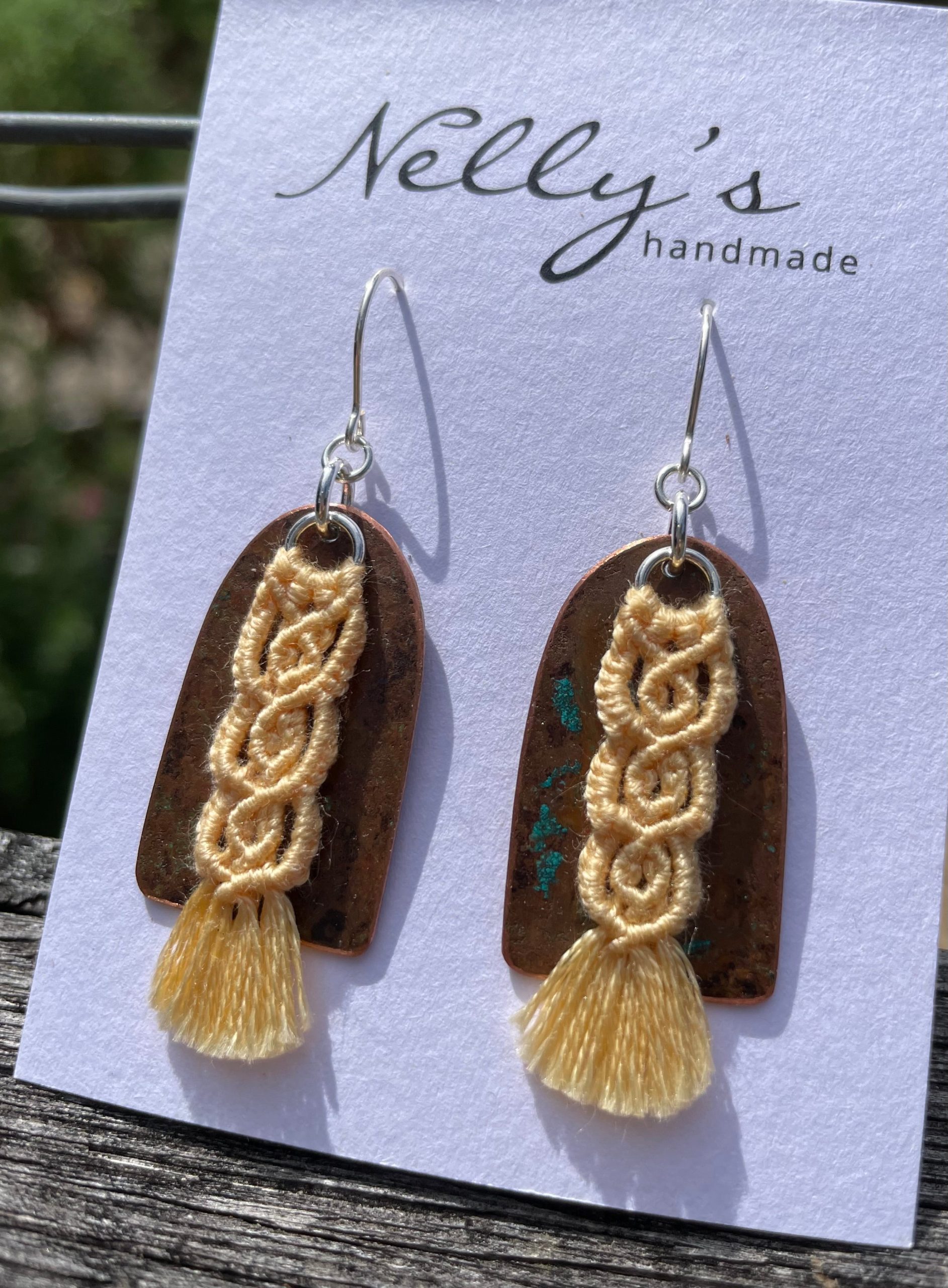 Yellow macrame thread on patinated copper