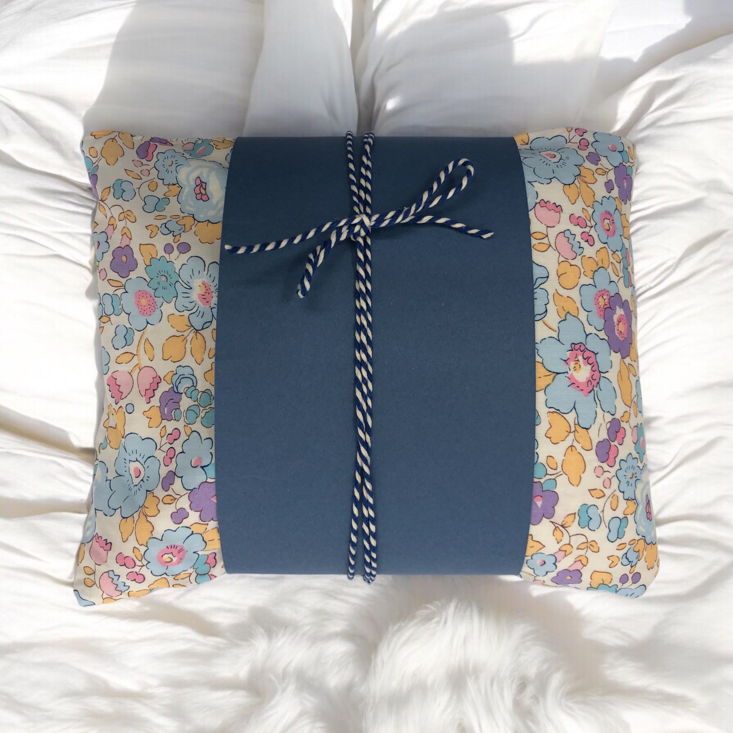 Wheat pack made with Liberty fabric outer layer and wheat in pouch inner layer