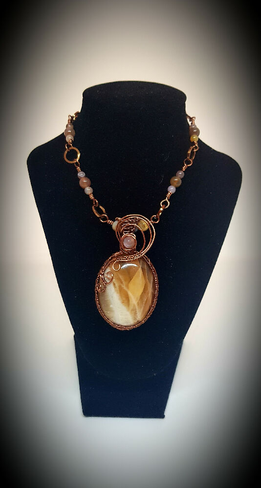"Movement " calcite: Rose cabochon pendant with Botswana Agate beaded necklace